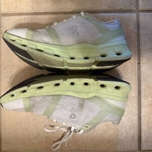 On Running White and Light Green Athletic Shoes